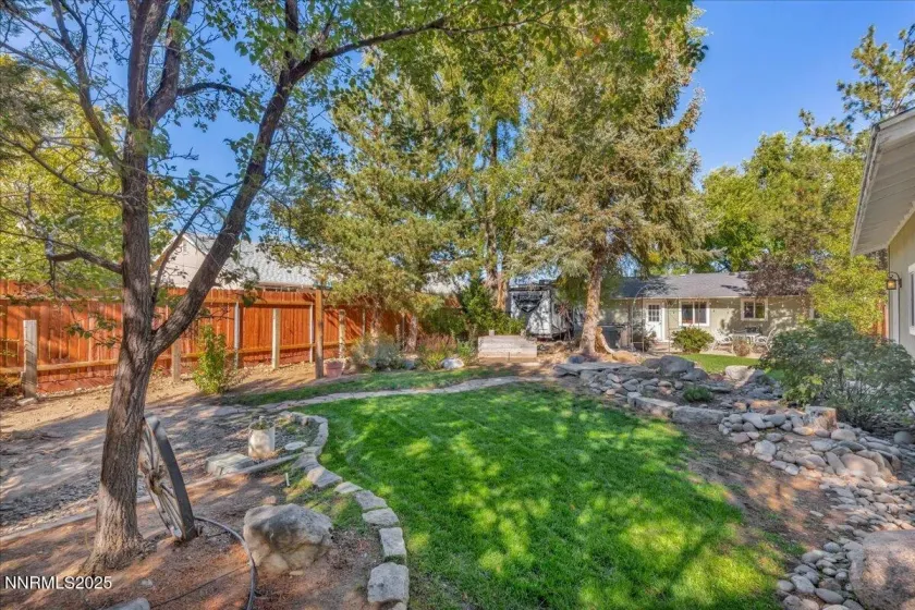 fully landscaped with fruit trees, garden boxes and irrigation.