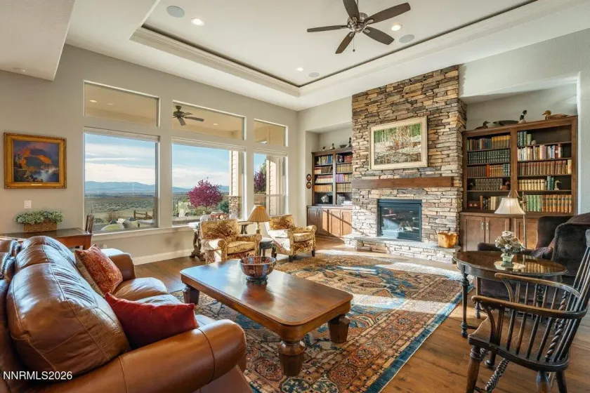 Perfectly curated custom home with impressive windows and custom coffered cielings.