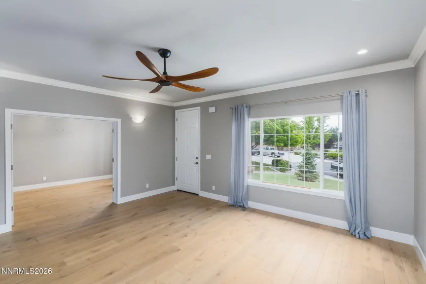 Looking towards front door and office/den from living room