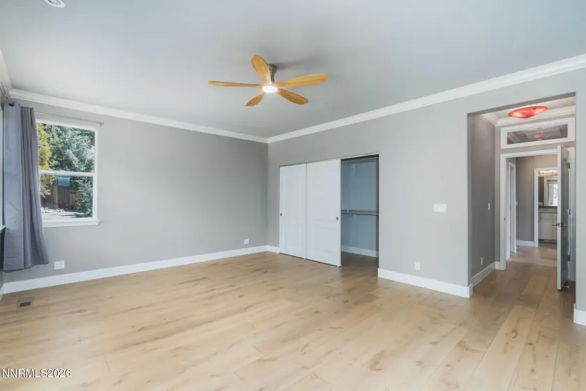 Primary bedroom with slider to the backyard