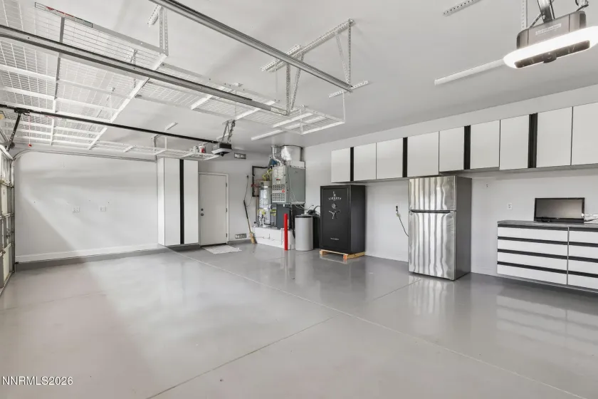 Fully finished garage with expoxy floors and custom cabinets