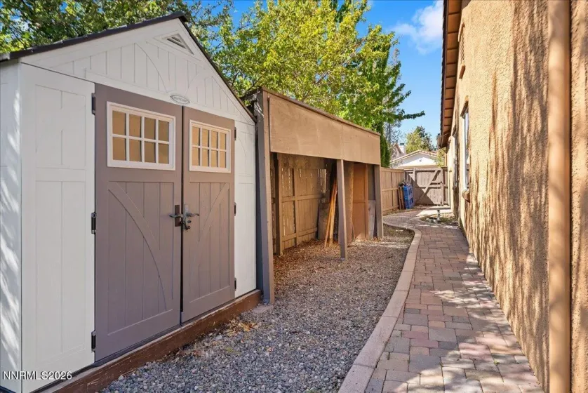 Side Yard with Shed, covered storage area and paver walk way