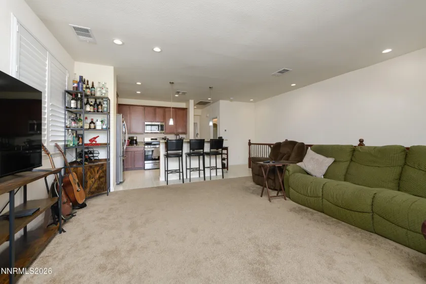 Living room into kitchen with breakfast bar