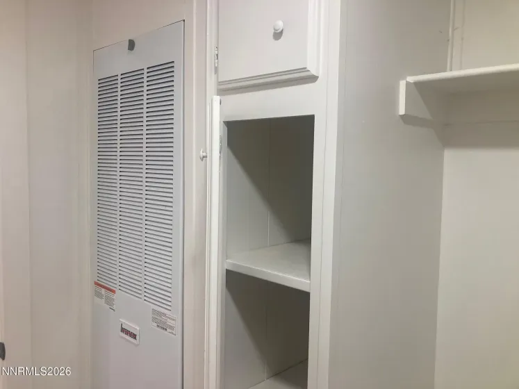 Laundry Room with Storage Closet and Shelf