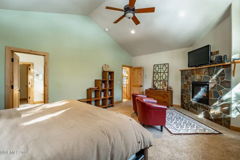 Primary suite retreat with vaulted ceilings, fireplace, and abundant natural light. 7
