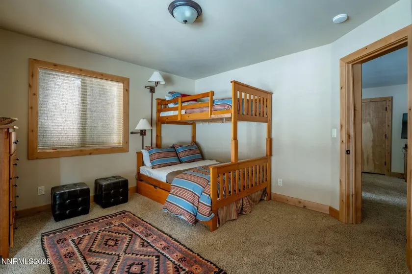 Guest bedroom with built-in bunk beds, offering flexible accommodations for visitors.