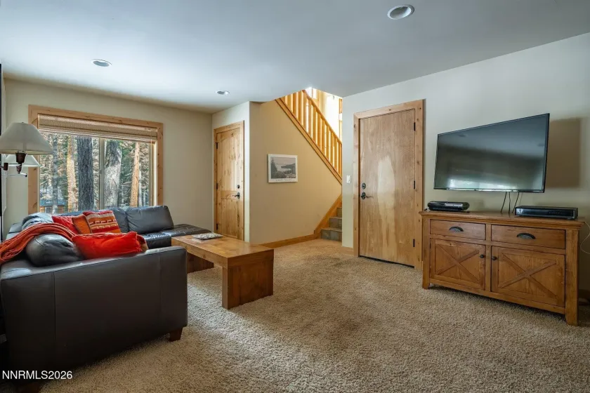 Inviting media and recreation room with comfortable gathering space.