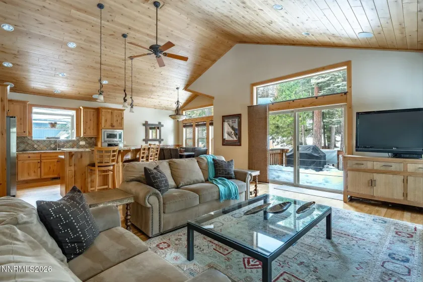 Spacious living area with floor-to-ceiling windows and seamless indoor-outdoor connection.