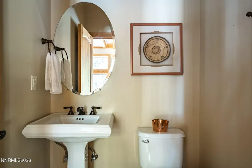 Convenient main level powder room serving the home's main living areas.