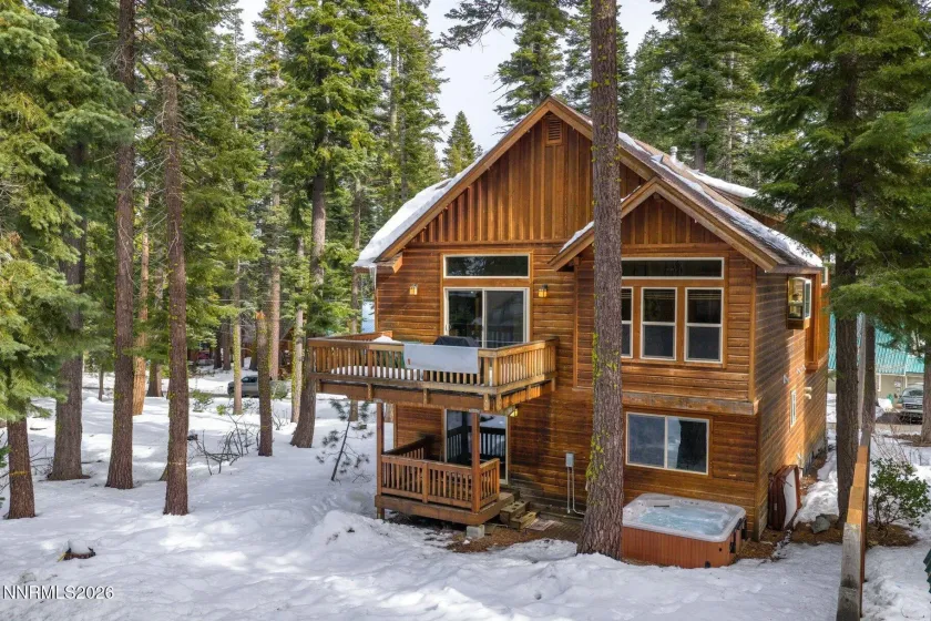 Classic Tahoe mountain home nestled among mature pines on a spacious wooded lot.