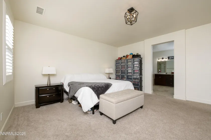Oversized primary bedroom w/ custom shutters