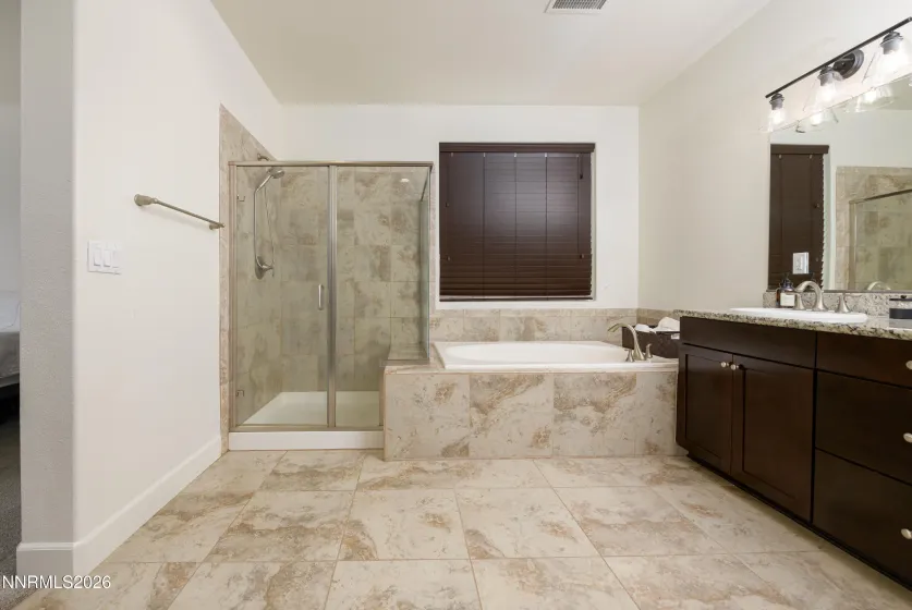 Primary Bathroom with Granite counters and separate shower/ garden tub w/ dual sinks