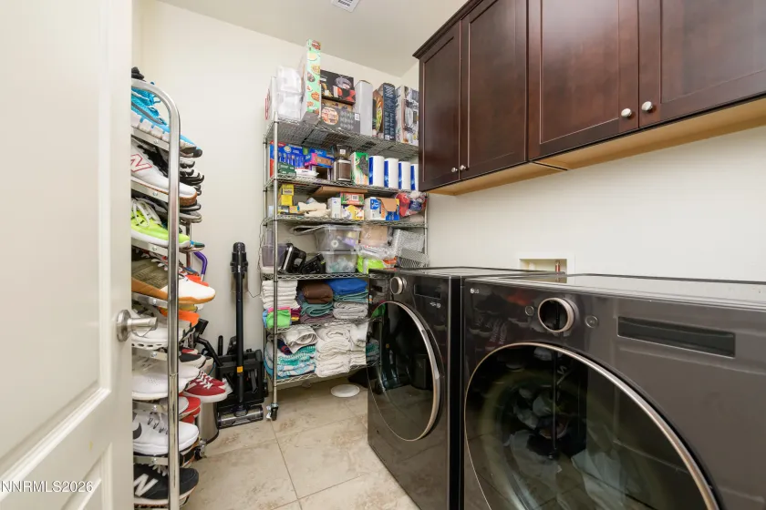 Large Laundry room w/ plenty of storage space