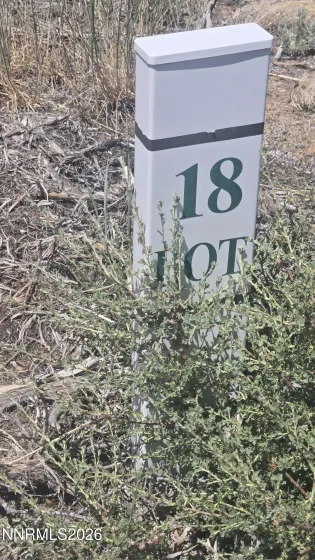 Lot marker behind For Sale sign