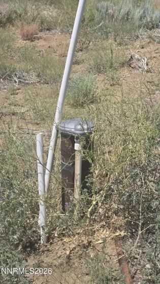 Well head marked with white rod