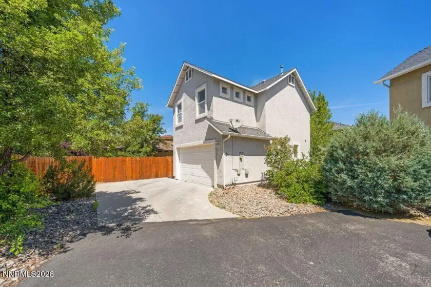 Back of house with driveway