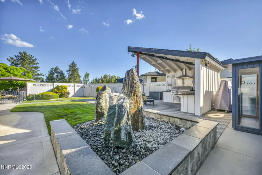 Water feature and outdoor kitchen