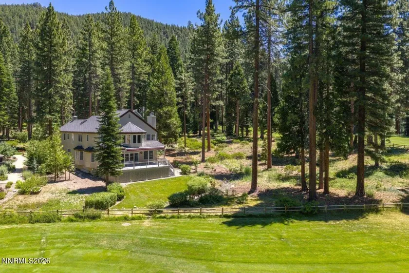 Rear view with green space on south side of home