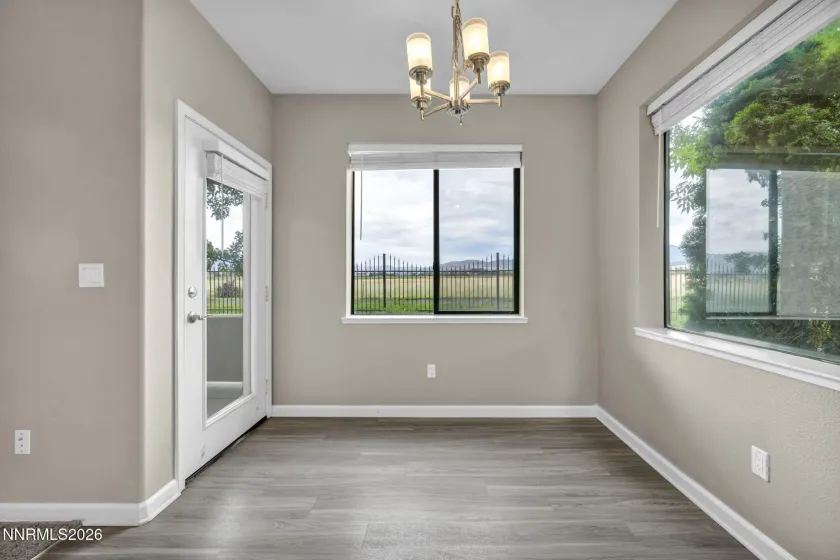 Kitchen Nook with Scenic View – Inviting kitchen nook featuring a dining space and a fabulous view through the window, creating a perfect spot to enjoy meals and the surrounding scenery.