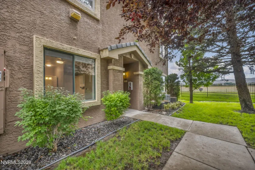 Front Exterior View – Side-angle view of the front of the condo showcasing the exterior, entryway, and welcoming curb appeal.
