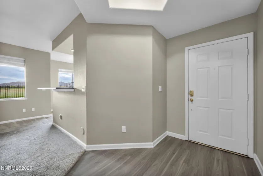 Front Entry – Welcoming front door entry with a glimpse into the bright and inviting living room.