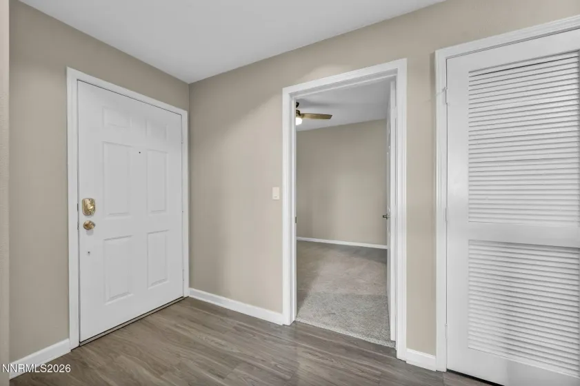 Front Entry & Secondary Bedroom – View of the front entrance with convenient access to the secondary bedroom.