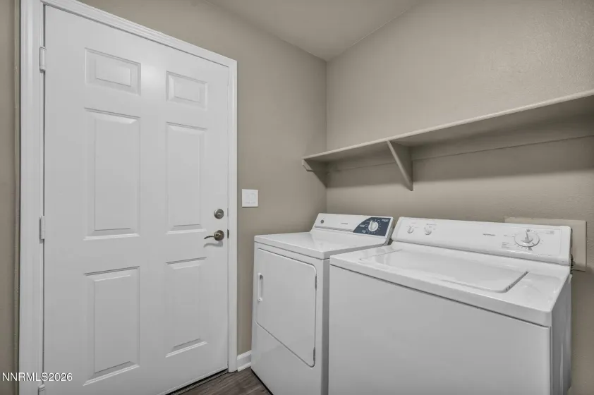 Laundry Room – Convenient laundry area featuring a built-in shelf for added storage and organization.