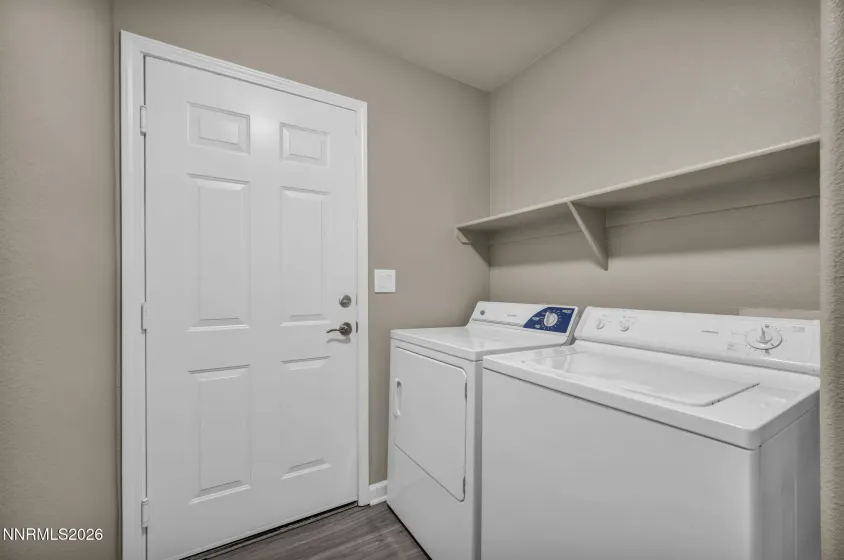 Laundry Room – Convenient laundry area featuring a built-in shelf for added storage and organization.