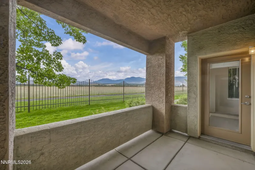 Covered Patio - Covered outdoor living space with convenient access from the kitchen nook, perfect for relaxing or entertaining.
