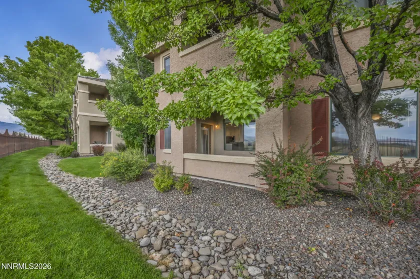 Rear View of Covered Patio – View from the back of the condo showcasing the covered patio and inviting outdoor living space.
