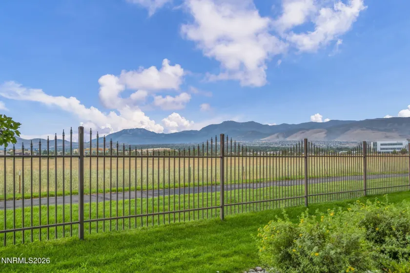 Scenic Patio View – Relax and enjoy the peaceful patio setting with beautiful views overlooking a meadow and surrounding mountains.