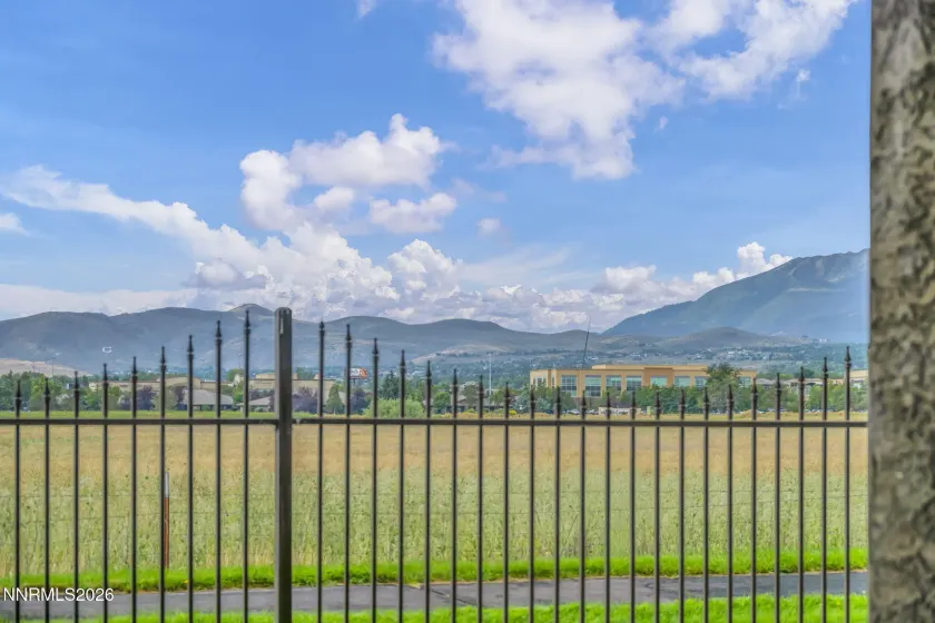 Scenic Patio View – Relax and enjoy the peaceful patio setting with beautiful views overlooking a meadow and surrounding mountains.
