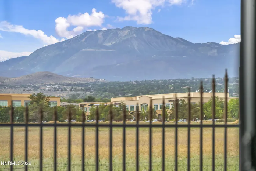 Scenic Patio View – Relax and enjoy the peaceful patio setting with beautiful views overlooking a meadow and surrounding mountains.