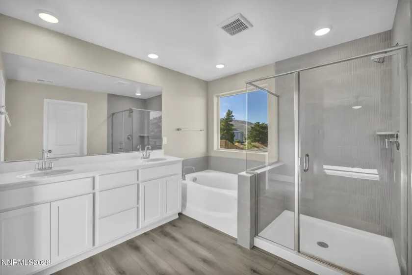 Separate tub/shower in primary bath.