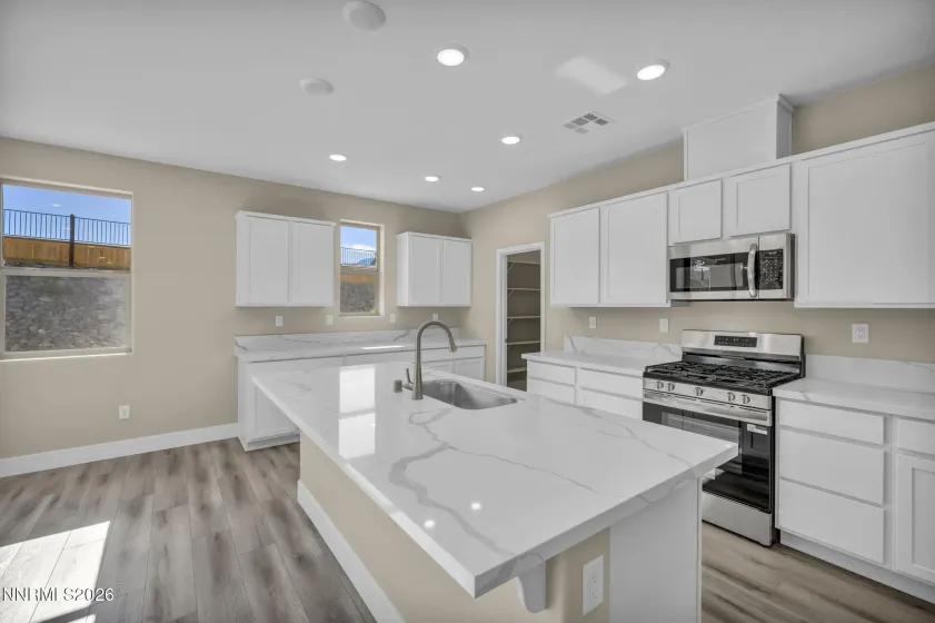 Tons of cabinet storage in kitchen