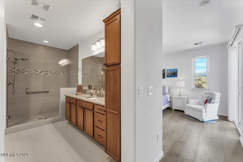 Generous cabinetry in primary bath.