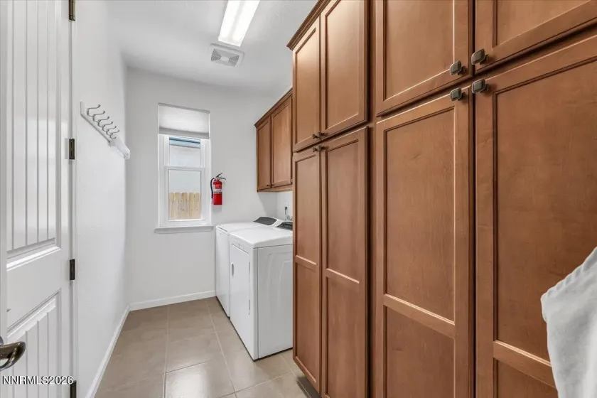 Floor to ceiling cabinetry for extra pantry space. Washer and dryer included in sale. .