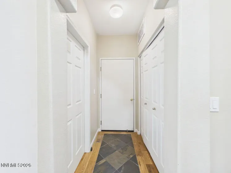 Hallway to garage, 2nd bathroom and laundry closet.