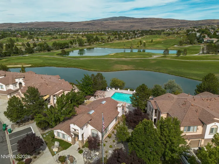 Clubhouse and community pool with golf course view.