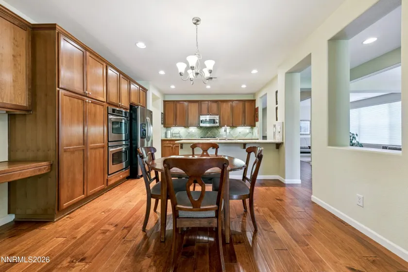 Enter into the open-concept kitchen and dining area, seamlessly connected to the spacious family room—an inviting space for everyday living and entertaining.