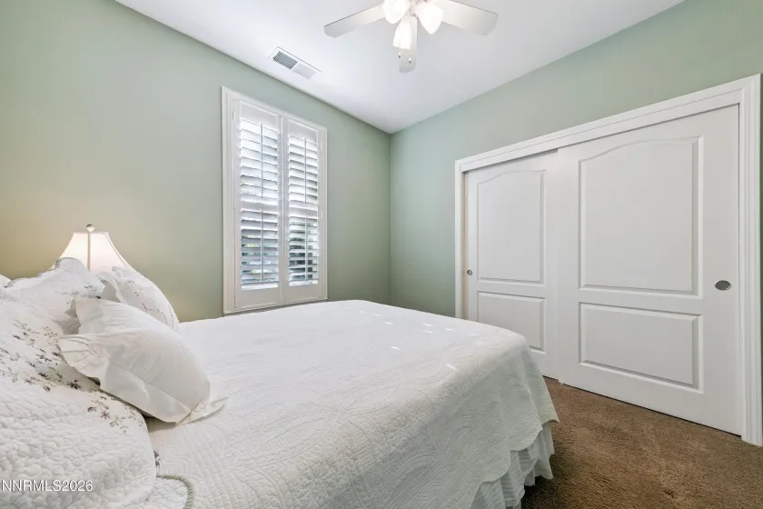 One of four bedrooms, offering comfortable accommodations and versatile living space.