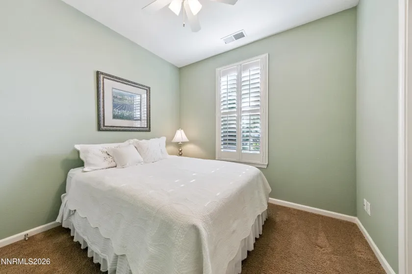 One of four bedrooms, offering comfortable accommodations and versatile living space.
