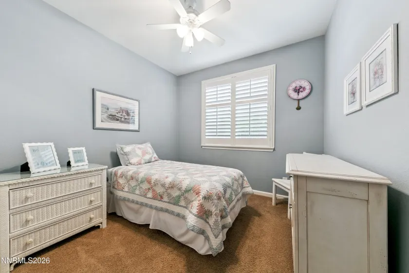 One of four bedrooms, offering comfortable accommodations and versatile living space.