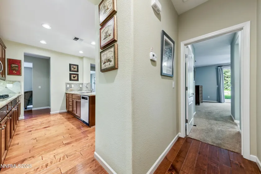Convenient hallway connecting the primary bedroom and the open-concept kitchen.