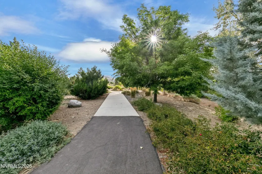Nearby paved walking paths offer convenient access to scenic outdoor strolls and leisurely recreation.