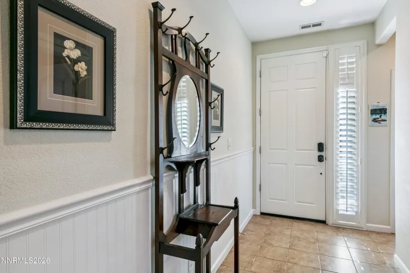 Enter the home into a dedicated entryway that provides a welcoming transition into the thoughtfully designed interior.