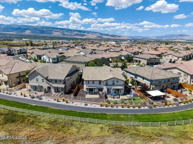 Aerial view of backyard, trail, and meadow