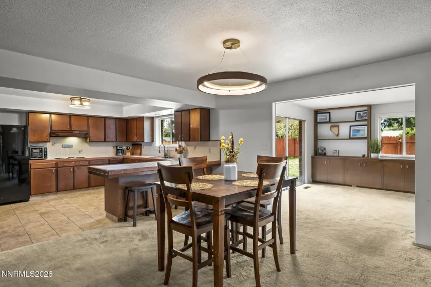 Dining area, kitchen and bonus room.