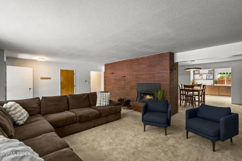 Living room with beautiful brick and fireplace