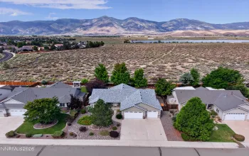 Aerial for the front of home with Sierra Nevada Mountains behind.